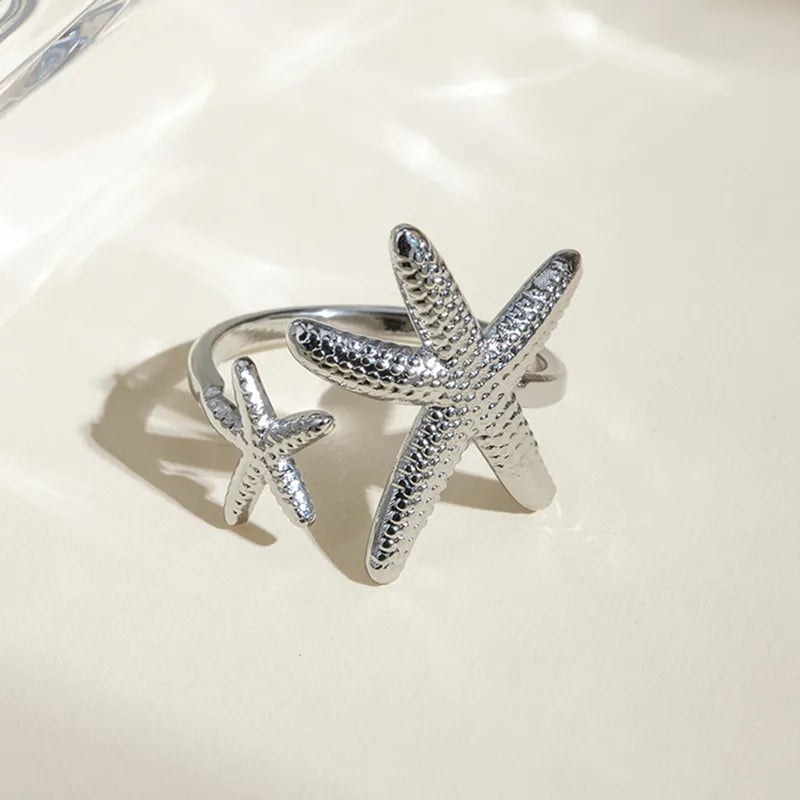 Anillo estrellas plateado